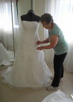 Jenny doing finishing touches to wedding dress